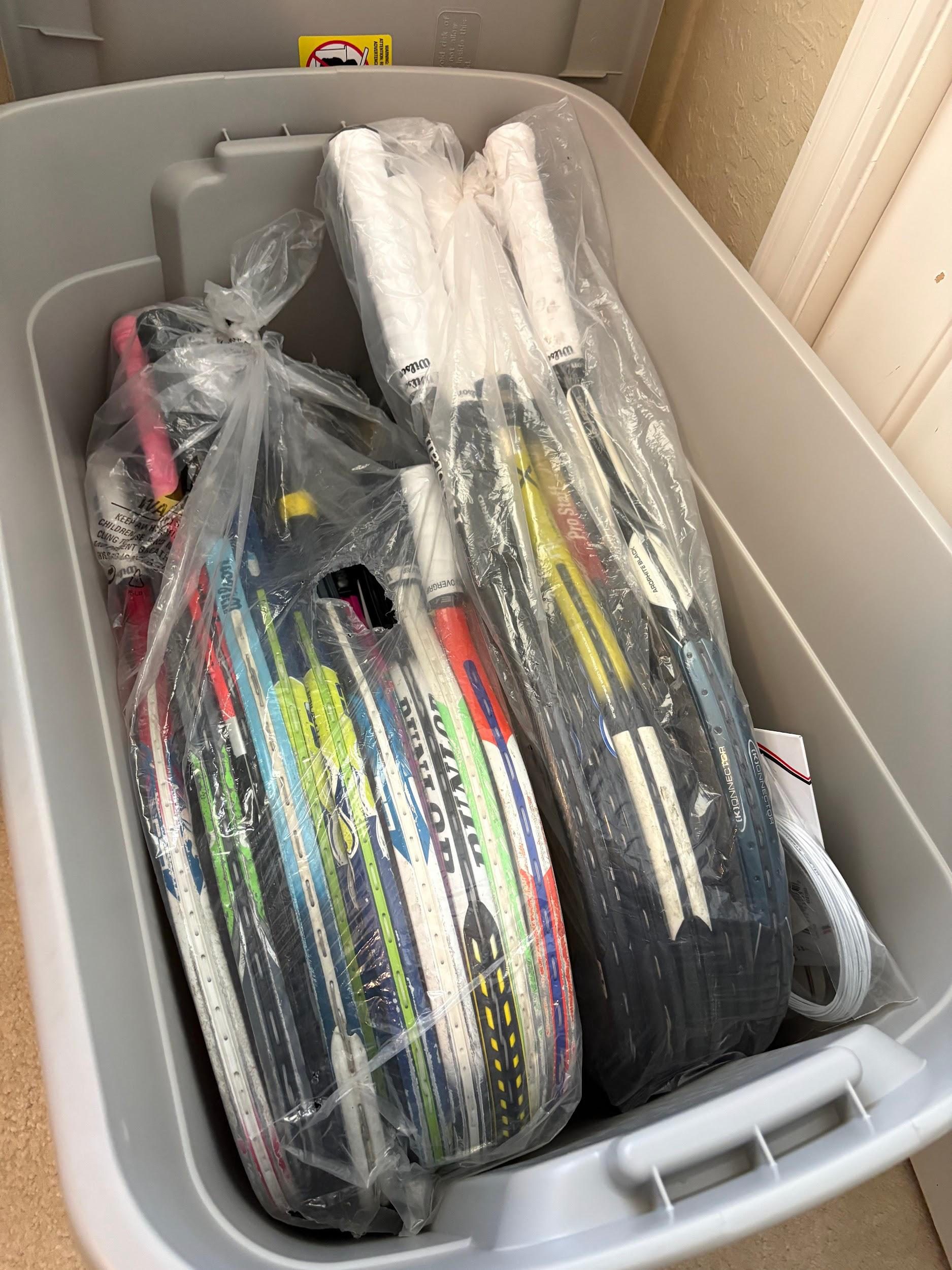 A bin of donated racquets from Coach Leslie