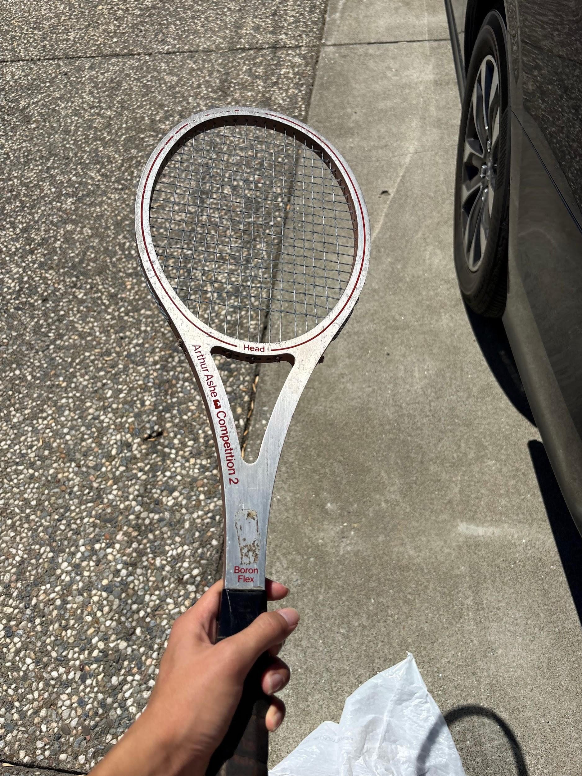 A donated vintage Arthur Ashe tennis racket